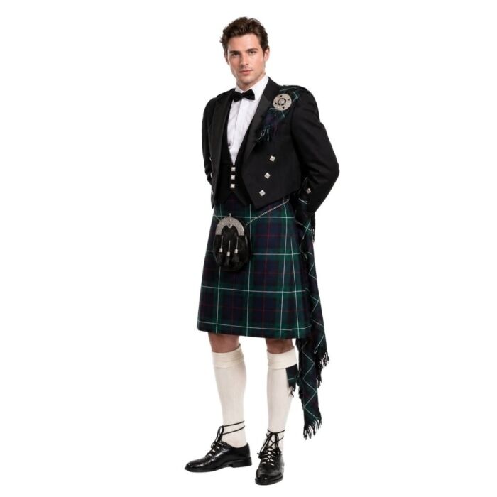 Man wearing prince charlie outfit on white background.